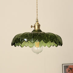 A hanging ceiling light with a green glass  shade designed to resemble a flower, with a visible bulb and a metallic gold finish.